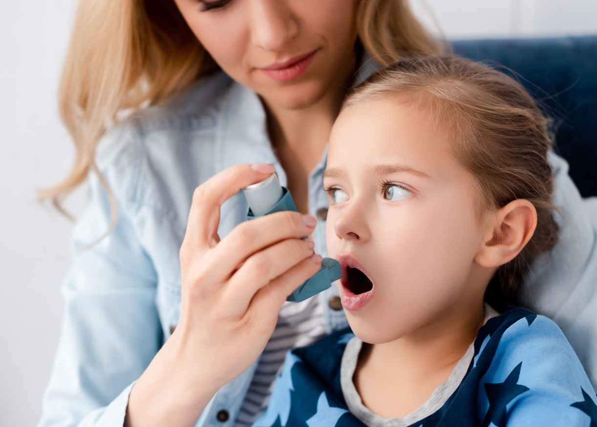 Close-up of hand holding AirPhysio Children's device