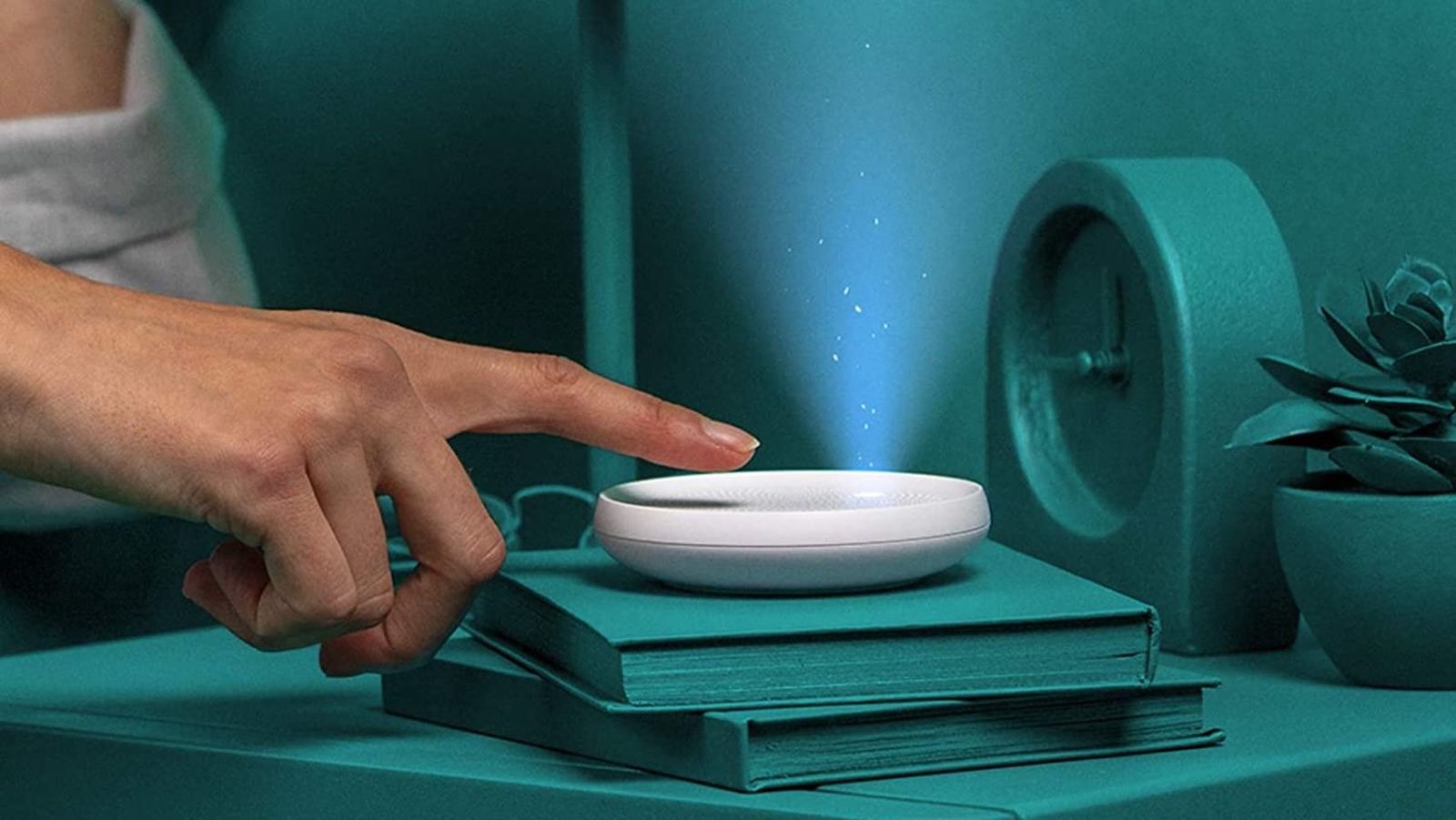 Dodow device being activated on a book, projecting light