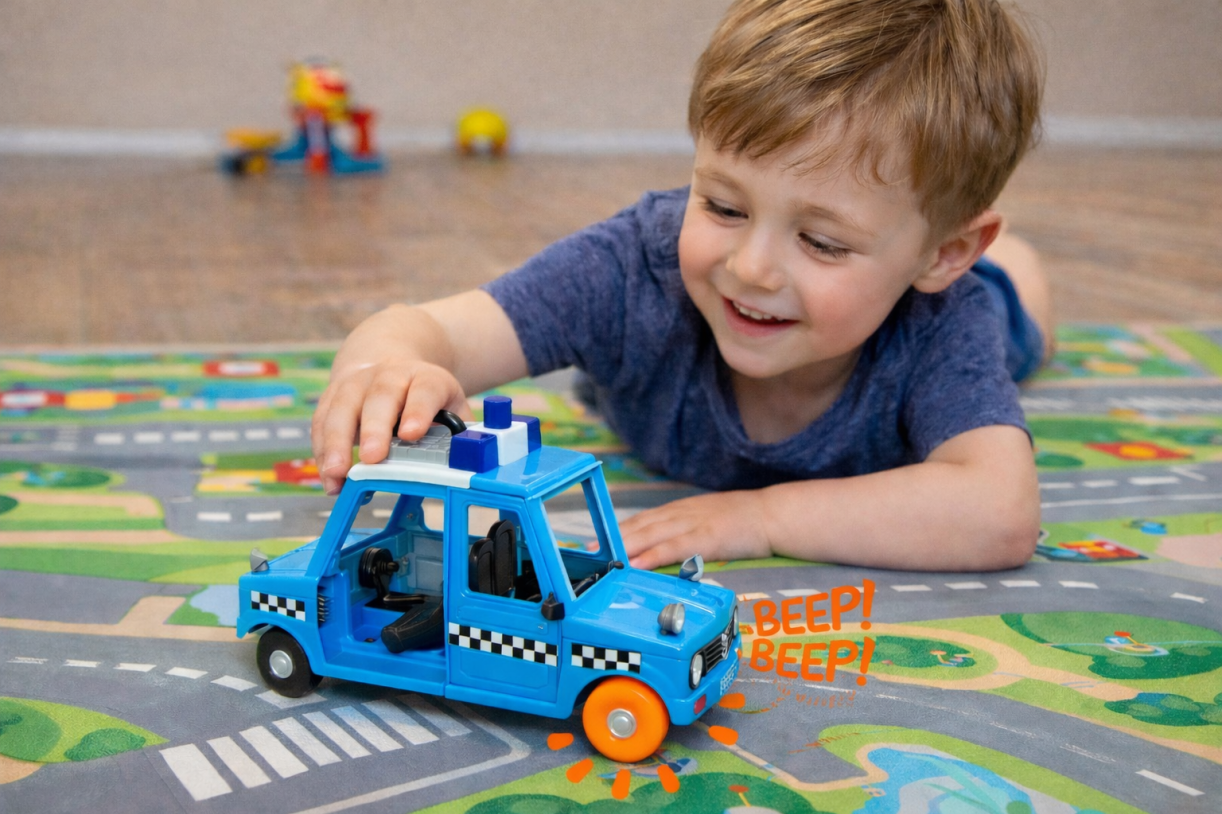 Child playing with a toy car that has an orange FixIts piece on the wheel