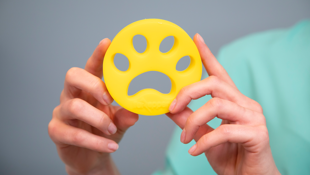 FurZapper silicone disc held up for display