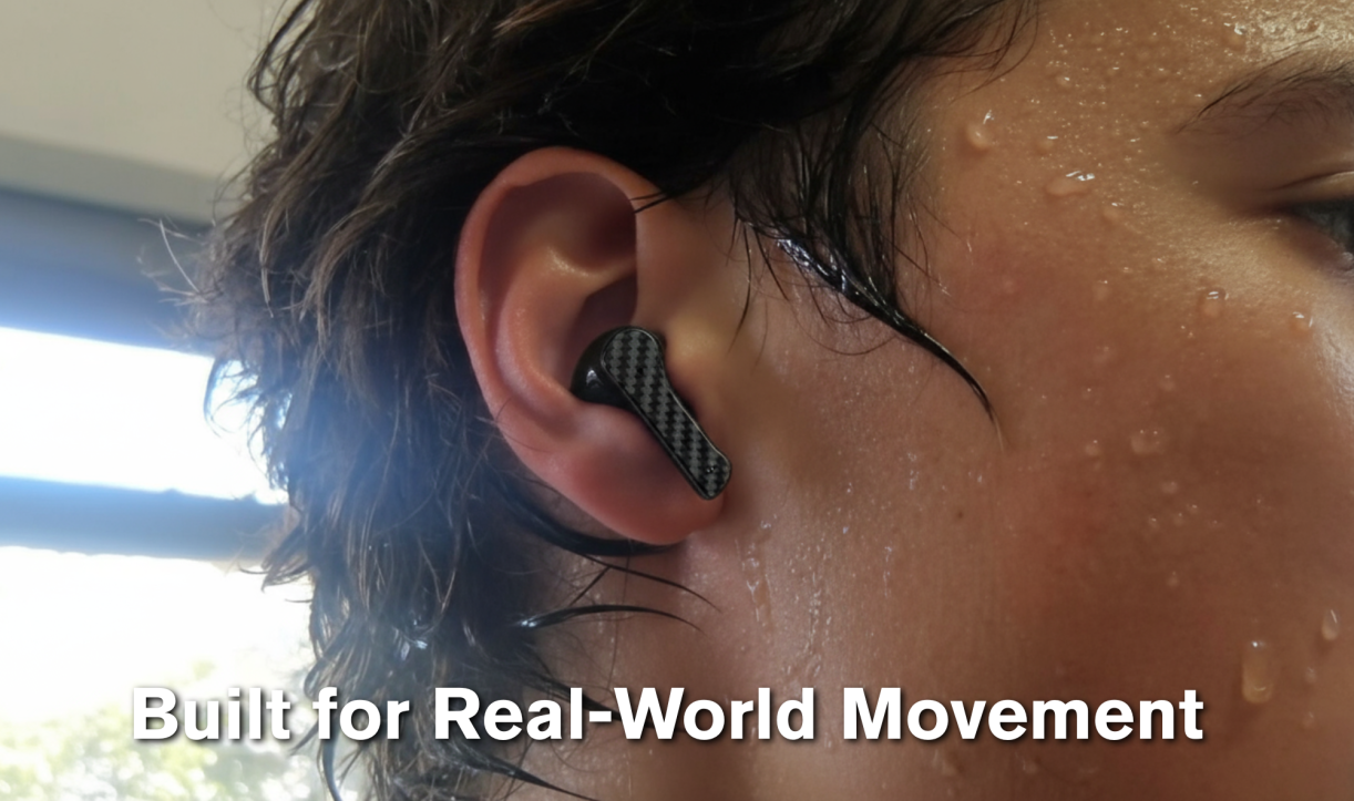 Person wearing Groovz earbuds while sweating, showing secure fit