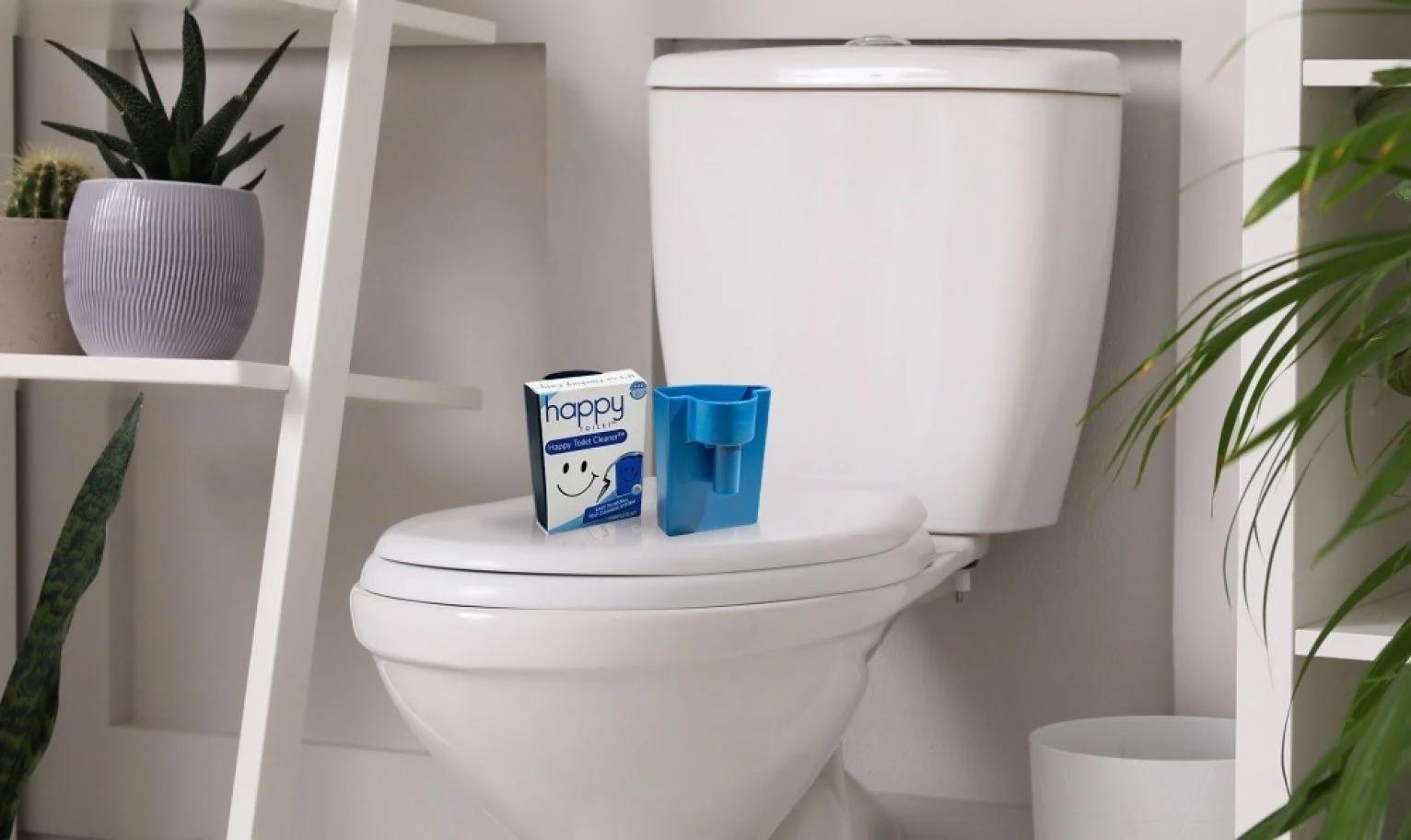 Product and packaging on toilet lid in a real bathroom