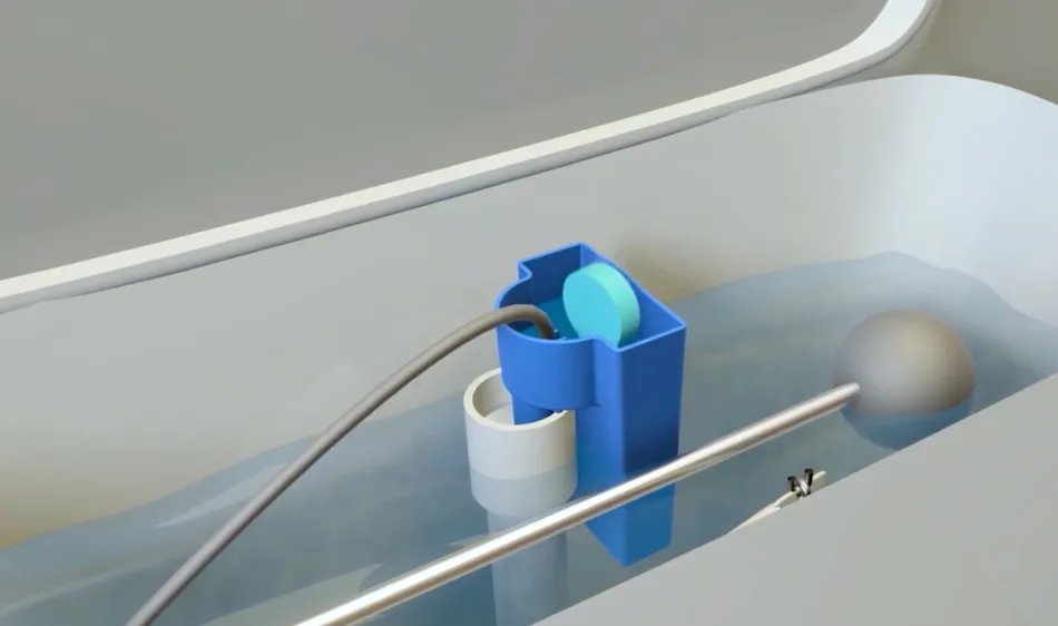 Box and blue toilet tank cleaner holder on closed toilet lid