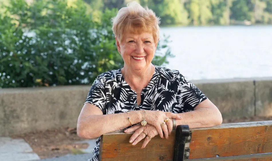 Older woman wearing invisaWear jewelry outdoors
