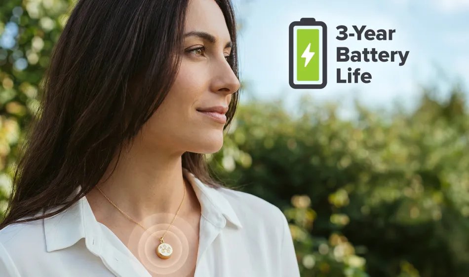 Woman wearing invisaWear necklace with '3-Year Battery Life' graphic