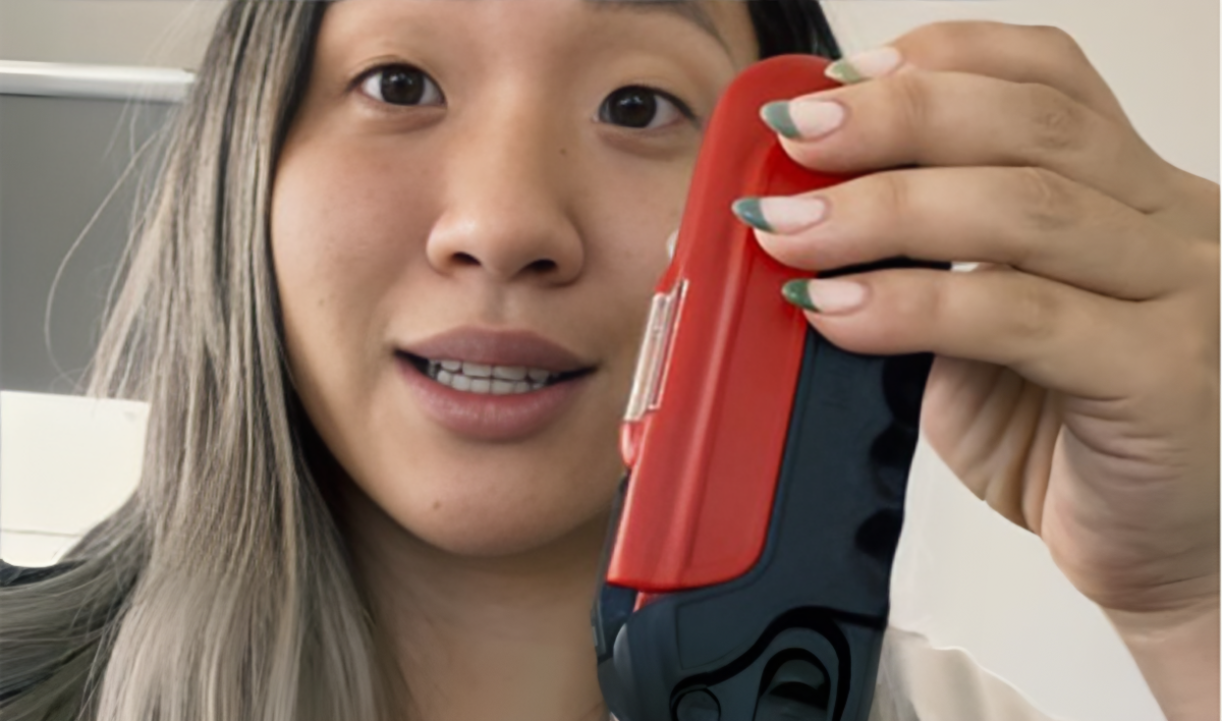 Customer holding Kelvin17 multi-tool and facing camera