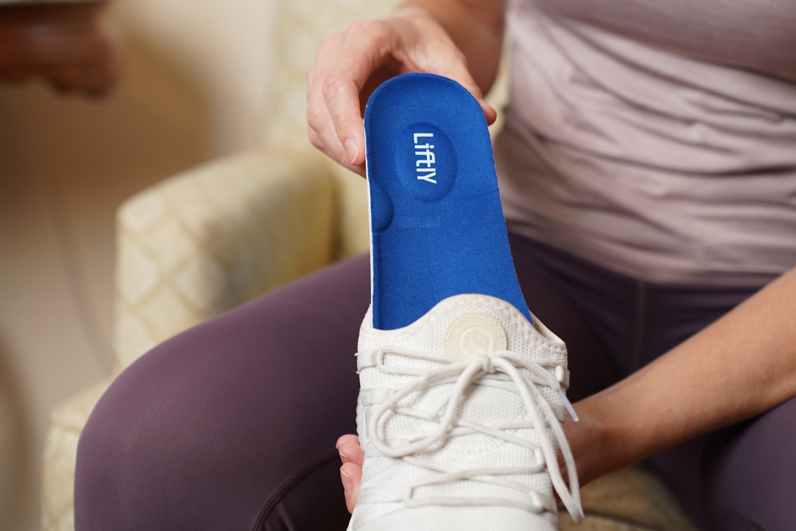 Side-by-side comparison of a worn insole and a new Liftly insole