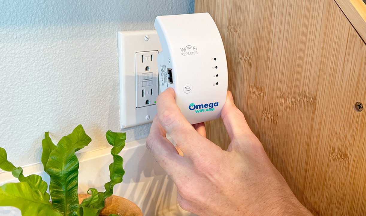 Plugging the Omega WiFi Amp into a wall outlet