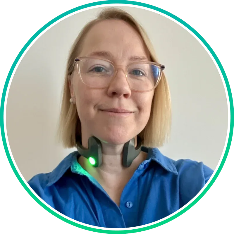 Customer selfie wearing Pulsetto device with green light on