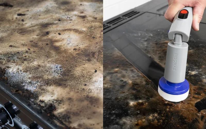 A person using a motorized cleaning brush to clean a dirty stovetop