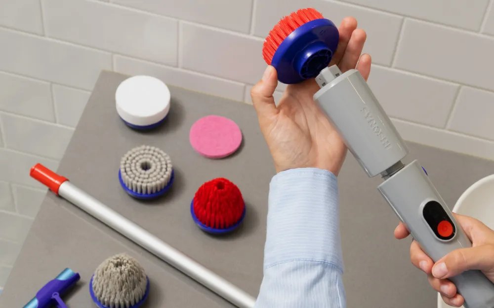 Synoshi Pro spin scrubber being used on a bathroom tile surface