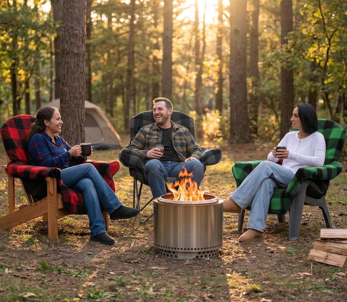 Three people using plaid chair blankets around a firepit in the woods