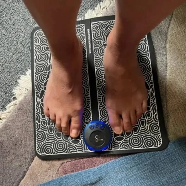 Customer using TheraFoot Pro at home