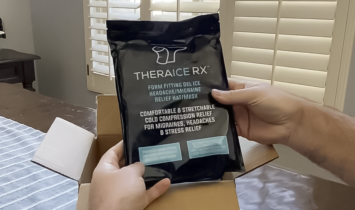 Hands holding TheraICE Rx package above shipping box