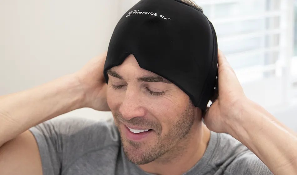 Person lying down with TheraICE Rx head wrap covering eyes and forehead