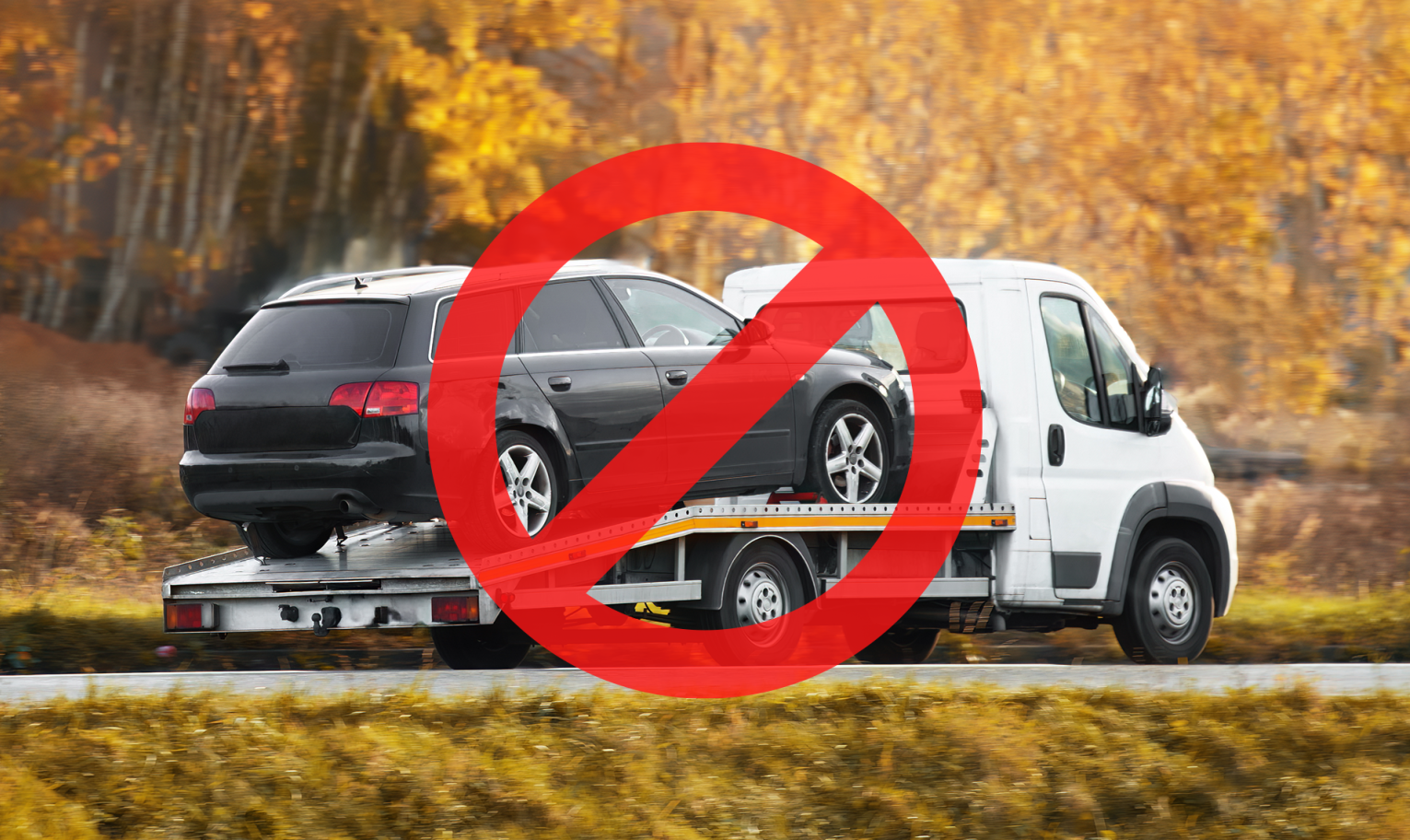 Car being towed on a flatbed truck with a red prohibition symbol