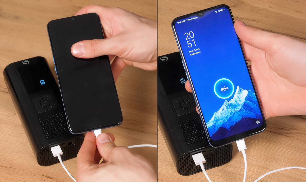Hands connecting a smartphone to TireHero to charge the phone