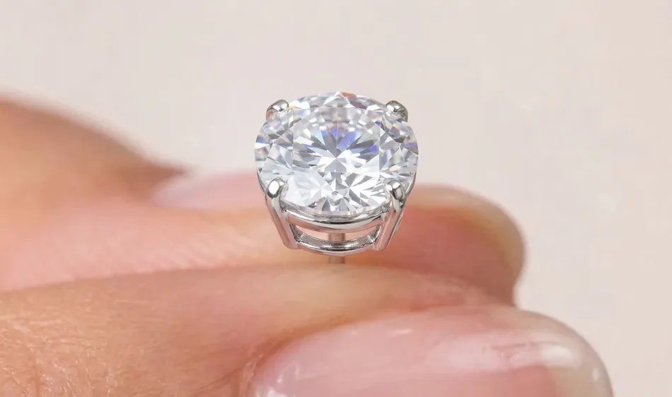 Sparkling Voss+Agin diamond stud earrings on white background