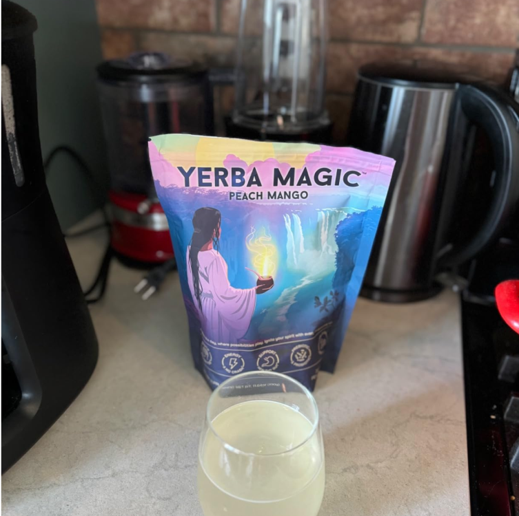 Yerba Magic Peach Mango powder and prepared drink on a kitchen counter